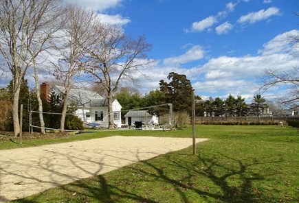 Falmouth Cape Cod vacation rental - Large fenced back yard with sand volleyball court