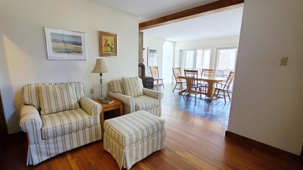 Wellfleet Cape Cod vacation rental - Cozy reading nook with dining area and screen porch beyond