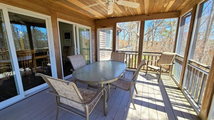 Wellfleet Cape Cod vacation rental - Screen porch with slider to dining area & door to deck with grill