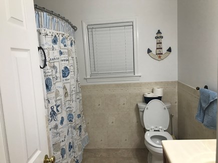 Dennisport Cape Cod vacation rental - Bathroom with full bathtub and shower.