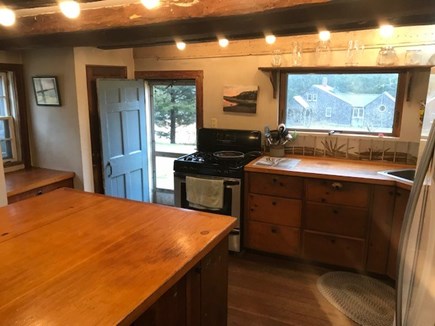 Truro Cape Cod vacation rental - Eat-in kitchen includes dishwasher and microwave.