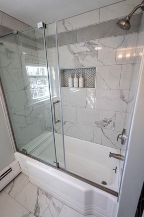 South Yarmouth Cape Cod vacation rental - Tub with high pressure shower head and sliding glass doors