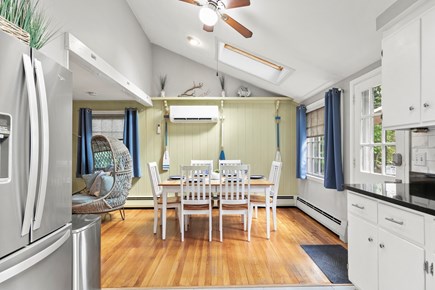 South Yarmouth Cape Cod vacation rental - Dining table off of kitchen and living room leads to patio door