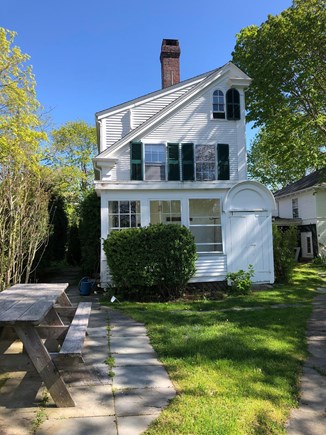 Yarmouth Port Cape Cod vacation rental - View of back of house, with picnic table/BBQ