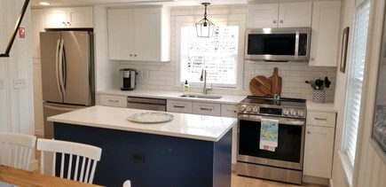 South Dennis Cape Cod vacation rental - New Kitchen cabinets, appliances, counters, and backsplash.