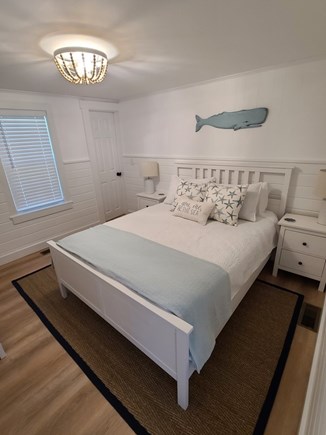 South Dennis Cape Cod vacation rental - Master Bedroom with door to bathroom, queen bed and smart tv.