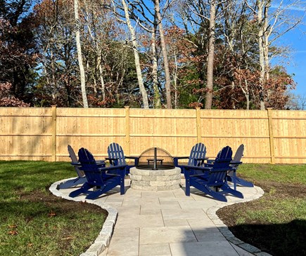 South Dennis Cape Cod vacation rental - Custom fire pit in 2023 with 6 new Adirondack chairs.