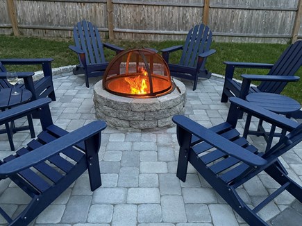 South Dennis Cape Cod vacation rental - Custom fire pit in 2025 with 6 new Adirondack chairs.