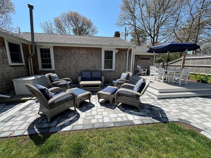 South Dennis Cape Cod vacation rental - Step down to a large patio with comfortable seating for 6.