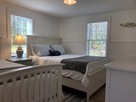 South Dennis Cape Cod vacation rental - 2nd bedroom with queen and twin beds and new smart tv.