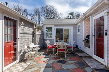 Eastham Cape Cod vacation rental - Central Entrance Courtyard with Grill and Dining Table