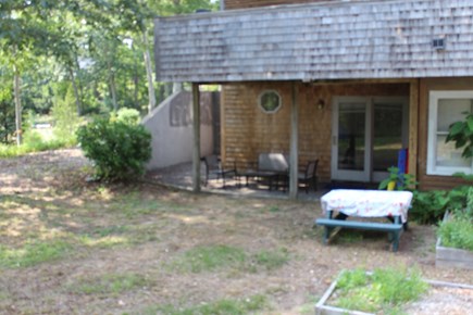 Eastham Cape Cod vacation rental - Lower level w/bistro set, picnic table,entrance to outdoor shower