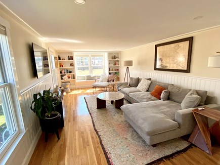 East Falmouth Cape Cod vacation rental - A cozy living room with a large couch, Smart TV and reading nook.