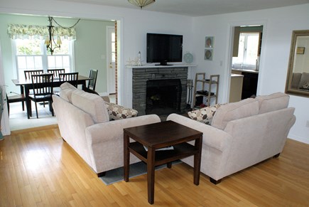 East Sandwich Cape Cod vacation rental - Living Room with fireplace opens to Dining & Kitchen