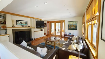 Wellfleet Cape Cod vacation rental - Living room with TV, comfortable furniture & door to screen porch