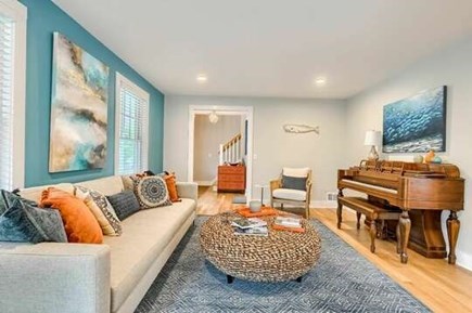Chatham Cape Cod vacation rental - Formal living room with bold colors and local artwork.