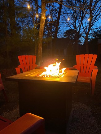 West Yarmouth Cape Cod vacation rental - Propane firepit outdoors with string lights