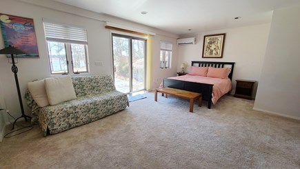 Wellfleet Cape Cod vacation rental - Lower level bedroom with queen and slider to patio with firepit