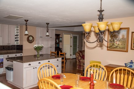 Hyannis Cape Cod vacation rental - Dining room with view of kitchen and living room
