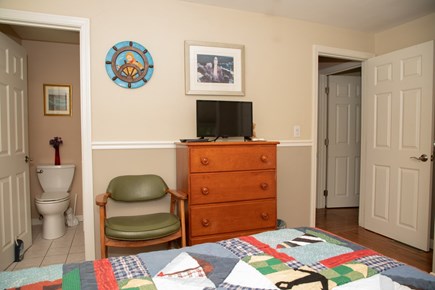 Hyannis Cape Cod vacation rental - Queen bedroom showing half-bath