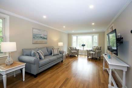 Osterville Cape Cod vacation rental - Living room with bay windows and view of wooded area