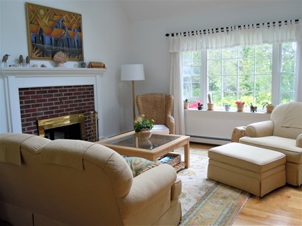 West Barnstable Cape Cod vacation rental - Sunny living room with fireplace and double-height ceiling