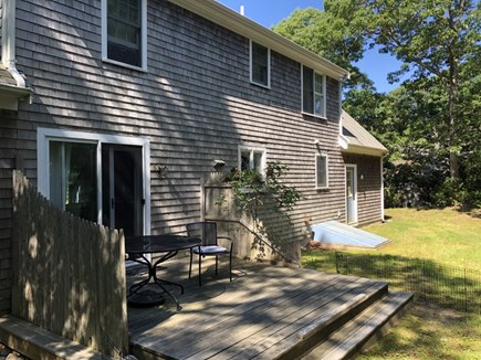 West Barnstable Cape Cod vacation rental - View of the back of the home, with sliders and deck