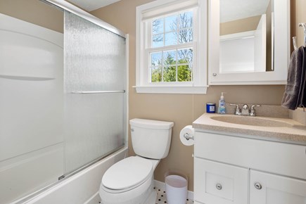 Falmouth Cape Cod vacation rental - Primary bathroom with shower and bath tub