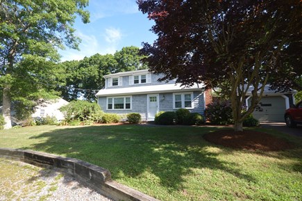 Falmouth Cape Cod vacation rental - Front of the house in full summer bloom
