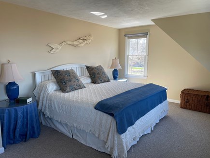 Sandwich Cape Cod vacation rental - Primary bedroom features king bed and marsh view. Window AC unit.