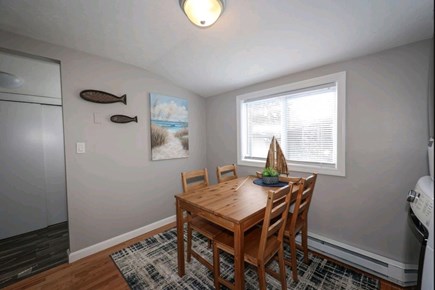 Manomet, Plymouth Manomet vacation rental - Dining area plus access to back yard to left