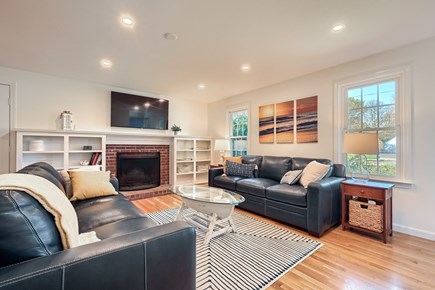 Eastham Cape Cod vacation rental - Open concept living room with Smart TV and fireplace
