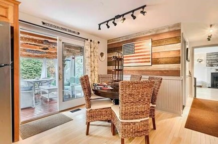 Harwich Cape Cod vacation rental - Dining area table and 5 chairs and slider to screened in porch