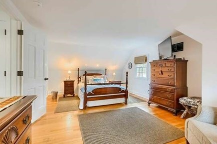 Harwich Cape Cod vacation rental - Bedroom 3 with a full bed, flat screen mounted tv and sitting are