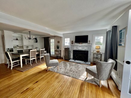 Eastham Cape Cod vacation rental - Living Room with Fireplace, TV and Dining Area