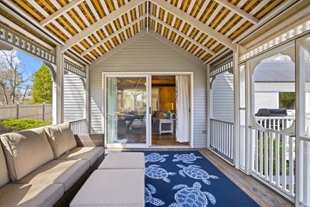 Barnstable Cape Cod vacation rental - Screened porch off the family room.