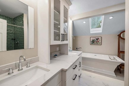 Barnstable Cape Cod vacation rental - Ensuite bathroom for primary bedroom with shower & two sinks