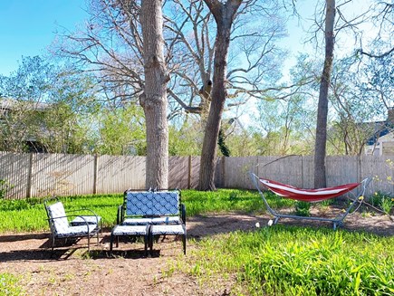 South Yarmouth Cape Cod vacation rental - Lounge in the tranquil backyard and listen to the birds sing