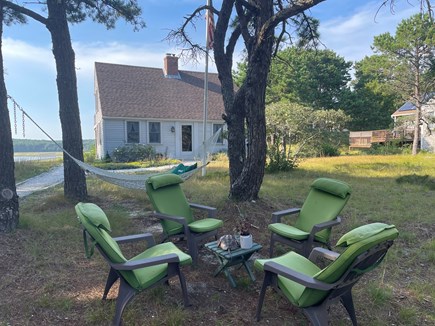 Wellfleet Cape Cod vacation rental - Sitting area and hammock under the south side pines.