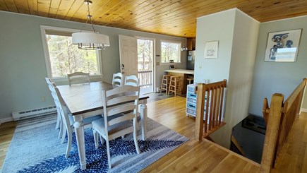 Wellfleet Cape Cod vacation rental - Dining area with kitchen beyond and stairs to first floor