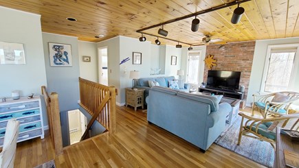 Wellfleet Cape Cod vacation rental - Living room with stairs to first floor and hall to master bedroom