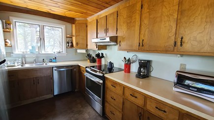 Wellfleet Cape Cod vacation rental - Well-equipped kitchen with counter seating & stainless appliances