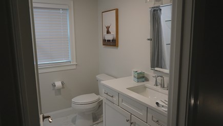West Yarmouth Cape Cod vacation rental - Upstairs shared bathroom with a tub and shower.