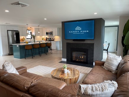 Dennis Cape Cod vacation rental - Gas fire place with 70 inch TV.   Large sectional.