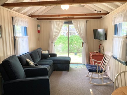 South Yarmouth Cape Cod vacation rental - The spacious living room with queen sofa bed and dining area.