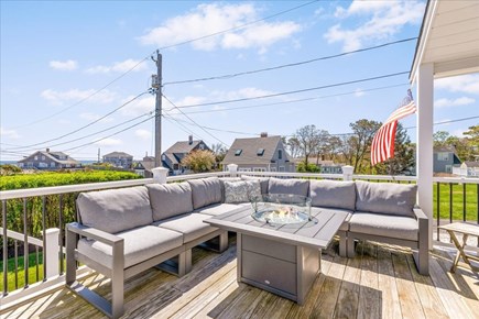 Sagamore Beach Cape Cod vacation rental - Outdoor propane fire pit with chairs and cushioned seats