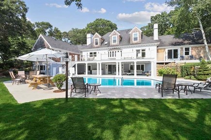 Hyannis Port Cape Cod vacation rental - Back view with pool hot tub and tennis court