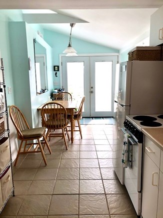 West Dennis Cape Cod vacation rental - Front door and dining area from kitchen