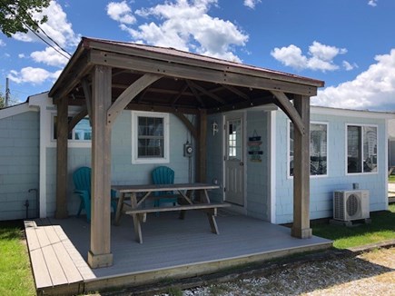 West Dennis Cape Cod vacation rental - Covered side/back deck with water view