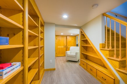 Sandwich Cape Cod vacation rental - Stairway to basement play area, Den and Bedroom